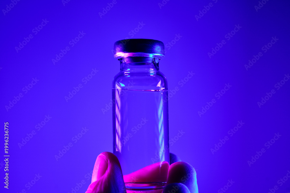 Fototapeta premium Hand holding glp 1 peptide medication vial for weight loss therapy