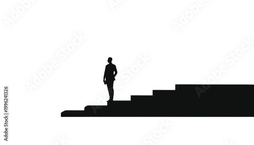 Businessman stands on the edge of a staircase while looking forward toward his future professional goals.