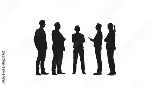 Business people stand together in a group to exchange professional ideas during a networking event.