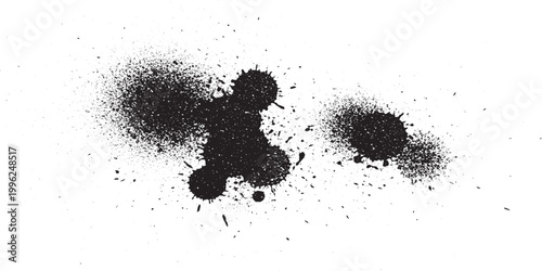 Cluster of black spray paint splatters and ink spots on white background with paint splash ink blot splatter abstract background distressed creative energetic