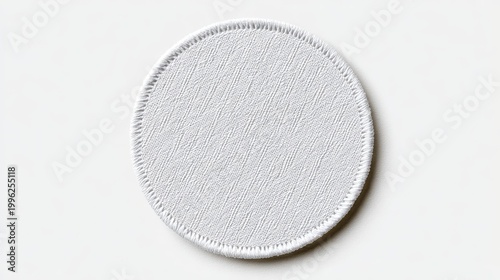 High quality photo of isolated rounded embroidered patch mockup with clear circular stitches on a blank white background, awaiting custom icon or logo design, ideal for branding and.