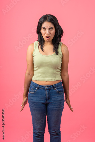 Fotografija Young woman showing disgust grimacing facial expression