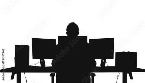 Worker sits at a desk with multiple computer screens to complete digital tasks in an office setting.