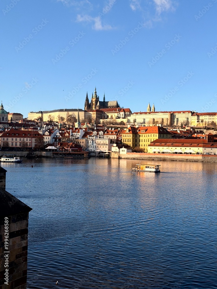 Fototapeta premium Prague Castle and Charles Bridge over Vltava river in sunny cityscape