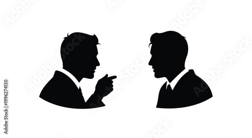 Two men in suits facing each other appearing to argue silhouette