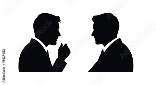 Two men in suits facing each other engaged in intense conversation silhouette