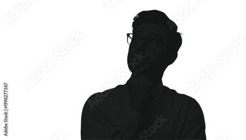 Businessman stands in profile against a white background while contemplating a complex future decision.