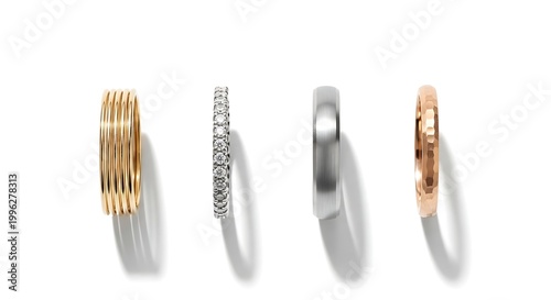 Four stylish rings displayed on a white background, showcasing different designs and metals.