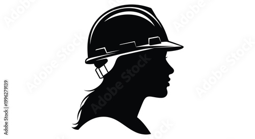 A woman wearing a hard hat in profile a striking silhouette
