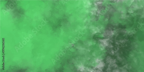 Green ink and grey smudge abstract background with emerald green and misty haze effect and smoky swirling patterns.