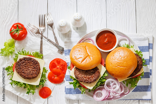 Beef cheeseburgers with brioche buns on a plate
