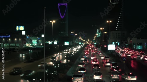 Riyadh City Skyline Aerial View Featuring Kingdom Tower and Heavy Traffic Flow on King Fahd Road, Saudi Arabia.