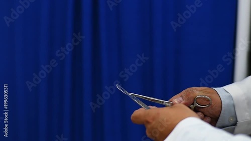1080p 60fps horizontal video of a doctor assembling his scalpel for a medical operation
