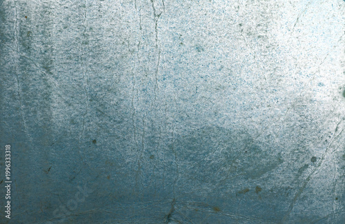 Tableau sur toile Abstract blue textured surface with iridescent sheen, worn marks, and glossy reflective detail