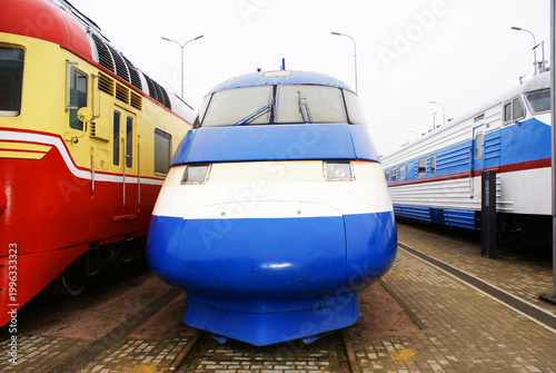 Old brightly painted commuter train. Train. Travel.