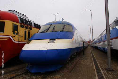Old brightly painted commuter train. Train. Travel.