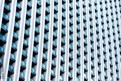 фотографія Modern abstract architecture presenting a repeating pattern of white facade elem