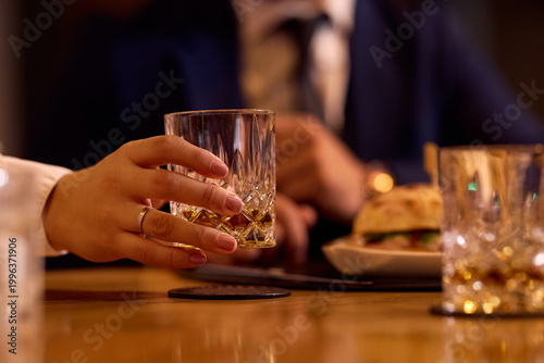 Принти на полотні Close up of waitress serving drinking during lunch in restaurant.