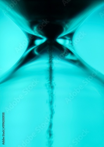 Hourglass as symbol of passing time life concept photo color light artistic macro close up
