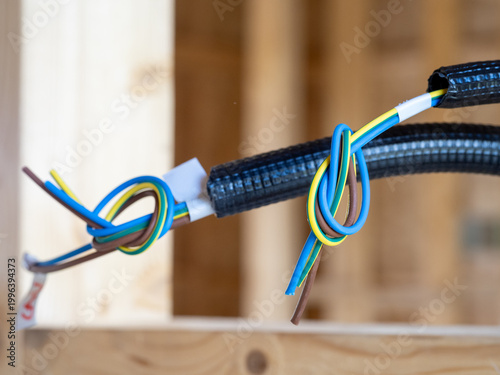 Foto Electrical installation details in a newly built wooden house, light frame syste