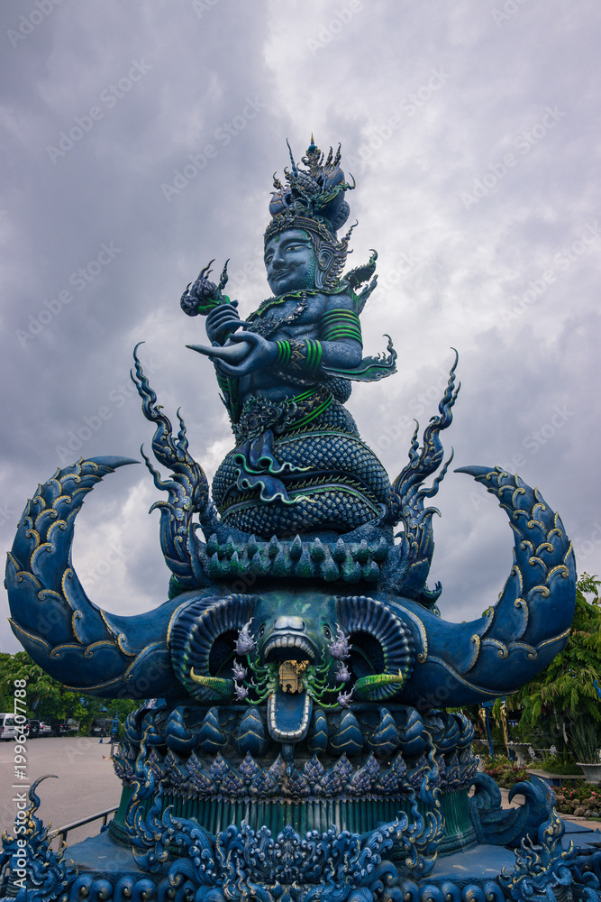 Fototapeta premium Vibrant Blue Temple Wat Rong Suea Ten with ornate gold details in Chiang Rai, Thailand