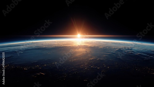 A breathtaking view of Earth from space showcases a vibrant sunrise illuminating the planet's curvature and the twinkling lights of cities below.