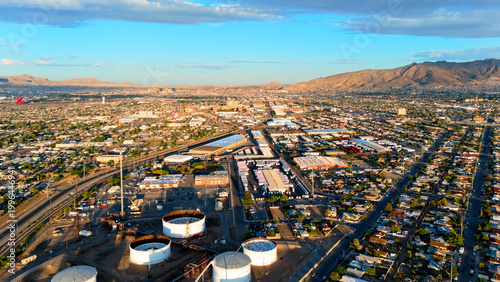 Aerial view of El Paso city skyline with industrial area and desert mountains
