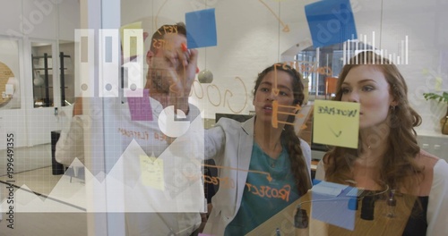 Obraz na płótnie Working three biz casual coworkers sketching on glass at office with orange mark