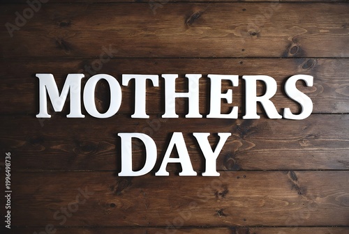 White capital letters spelling 'MOTHERS DAY' on a rustic dark brown wooden plank background, celebrating the special occasion.