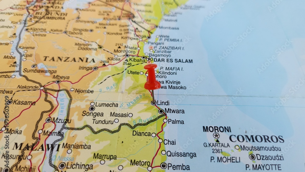 Obraz premium View of Lindi, is a historic coastal town in southern Tanzania, on a geographical map of Africa, marked with red push pin