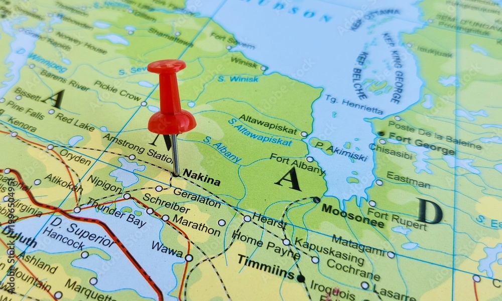 Obraz premium View of Nakina, is a community in the Town of Greenstone in the Thunder Bay District in Northern Ontario, Canada, on a geographical map of America, marked with red push pin