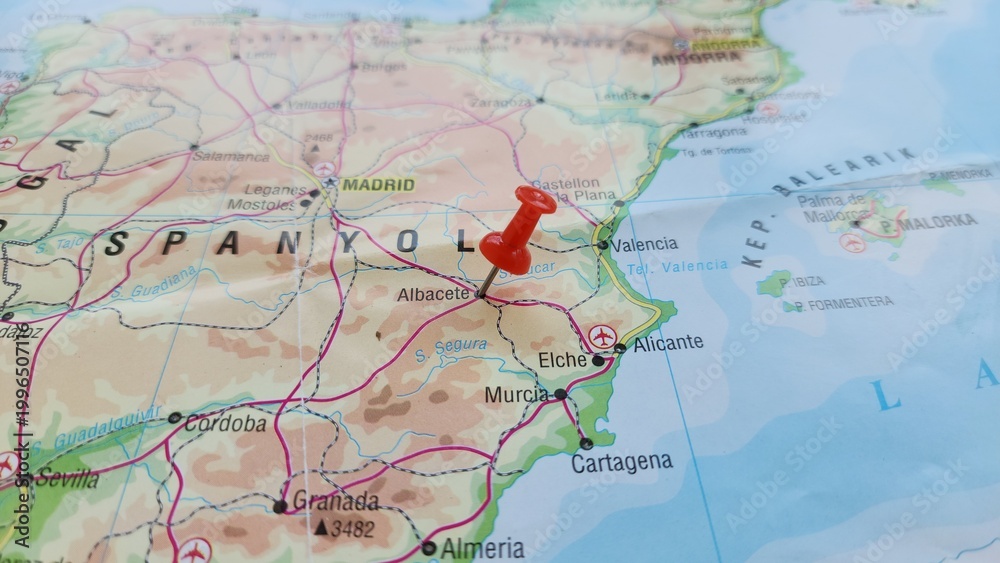 Obraz premium View of Albacete, is a city and municipality in the Spanish autonomous community of Castilla–La Mancha, and capital of the province of Albacete on a geographical map of Europe, marked with red pin