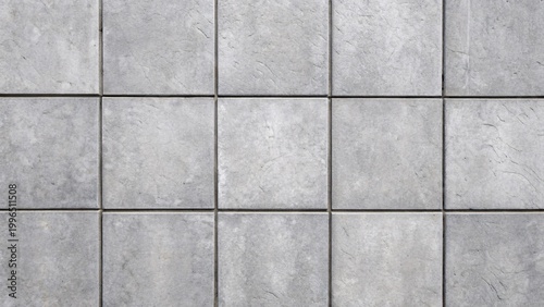 Gray concrete tiles with square pattern and grout lines