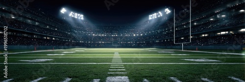 Illuminated football stadium at night with a packed crowd