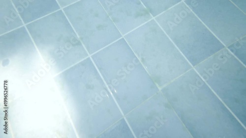 Dirty sediments on the bottom of swimming pool., Underwater
