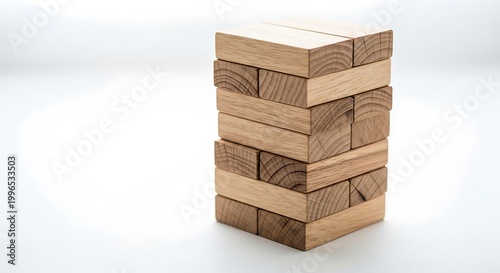 Stacked wooden blocks game tower on a white background