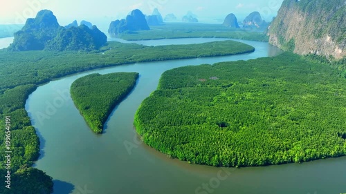 Aerial perspective of mangrove island shaped like a heart symbolizes rich estuarine habitats, scenic geology, ecological balance, and nature preservation. Samet Nangshe, Phang Nga, Thailand. 4k.
