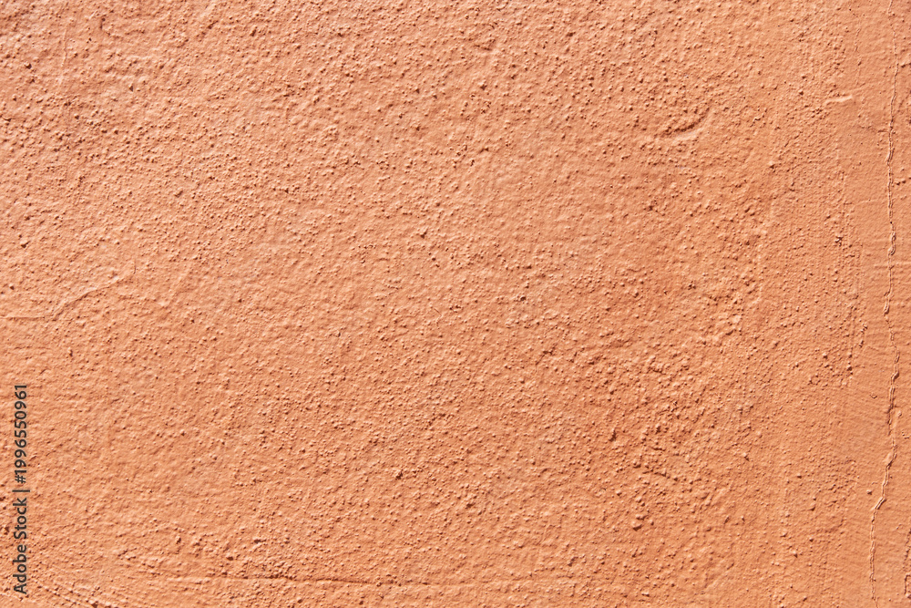 Fototapeta premium Terracotta textured wall background. Orange painted surface