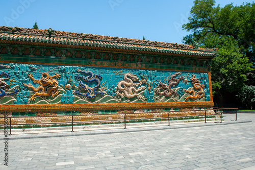Beijing Beihai Park's Nine-Dragon Wall was built in the 21st year of the Qianlong reign of the Qing Dynasty (1756). It is a colored glazed brick shadow wall in a wooden structure imitation style.