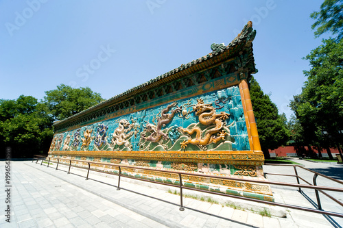 Beijing Beihai Park's Nine-Dragon Wall was built in the 21st year of the Qianlong reign of the Qing Dynasty (1756). It is a colored glazed brick shadow wall in a wooden structure imitation style.
