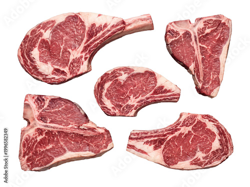 Fotografie An enticing collection of premium raw beef cuts, including ribeye steaks and a porterhouse