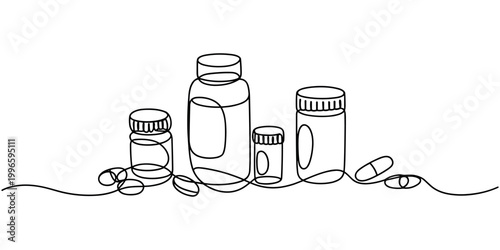 Black and white line of medicine bottles and scattered pill capsules line black and white pharmaceutical