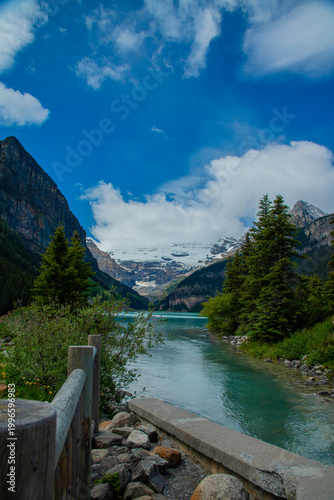 Breathtaking view of Moraine Lake in the Valley of the Ten Peaks, Banff National Park, Alberta, Canada. Vibrant turquoise glacial water surrounded by towering rocky mountains and pine forests