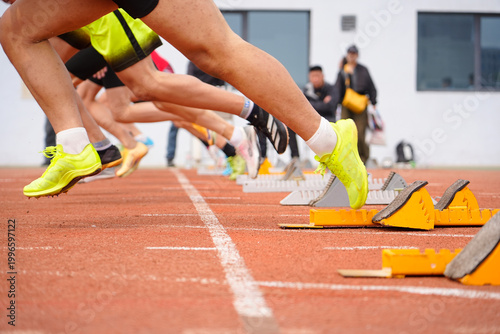 Close-up of Sprinters at the Starting Blocks
