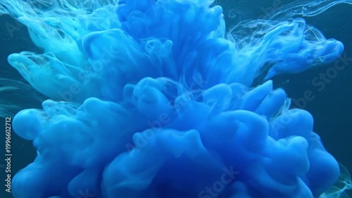 Blue Ink Cloud Swirling Gracefully in Water