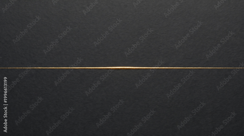 Fototapeta premium Minimalist elegant background with a thin glowing gold line over a dark textured black paper surface.