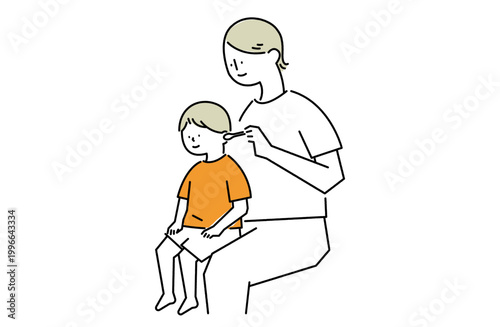 男の子を膝に乗せて耳掃除をするお母さん