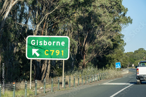 A green Australian road directional sign indicating the turn-off to Gisborne via route C791, n a regional highway in Victoria Australia. Road infrastructure and motorway signage