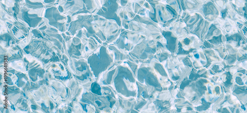 Obraz na plátně Top View Crystal Clear Blue Swimming Pool Water Surface with Ripple and Caustics
