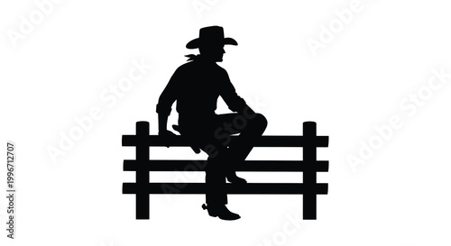 A cowboy sits on a wooden fence gazing into the distance silhouette